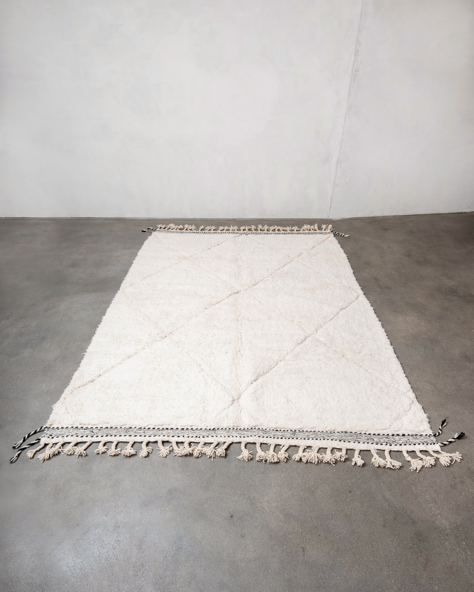 Modern, designer, handcrafted Berber rug from Morocco. Beniourain carpet with beautiful colours and patterns and fluffy wool texture.
